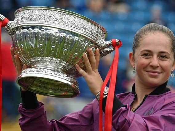 Jelena Ostapenko of Latvia with the trophy after beating Anett Kontaveit of Estonia in the Viking International final at Devonshire Park / Picture by Charlie Crowhurst/Getty Images