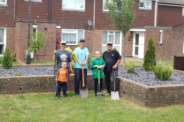 Residents Dave Saunders, Mark Luffman and Isabel Carvalho with some of the completed work in the communal area at Beale Court in Bewbush