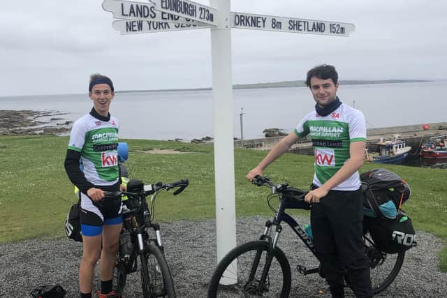 Jack Evans and Sam Alford from Pulborough at John o' Groats for the start of their 1,000 mile cycle SUS-210629-090855001