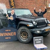 Piotr Czajka celebrates his win with his new Jeep and BOTB presenter Christian Williams