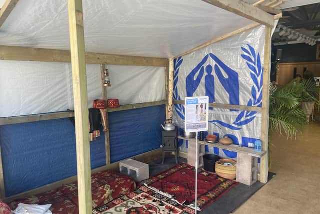 Replica refugee tent, similar to those built by Syrian refugees in Lebanon. Photo by Liz Fawkes