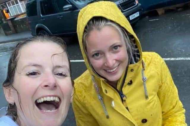 From left: Hassocks business owners Hayley Elphick and Kelly Harding during the downpour. Picture: Hayley Elphick