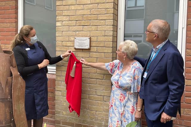 Chief nurse Maggie Davies joined the Rev David and Sandra Hill to unveil a plaque in memory of the couple's sons, Stuart and Jason