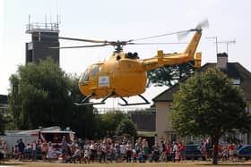 Worthing Fire Station open day in 2006, with an air ambulance helicopter landing  on Broadwater Green to promote the opening of the appeal fundraising office. Pictures: Stephen Goodger