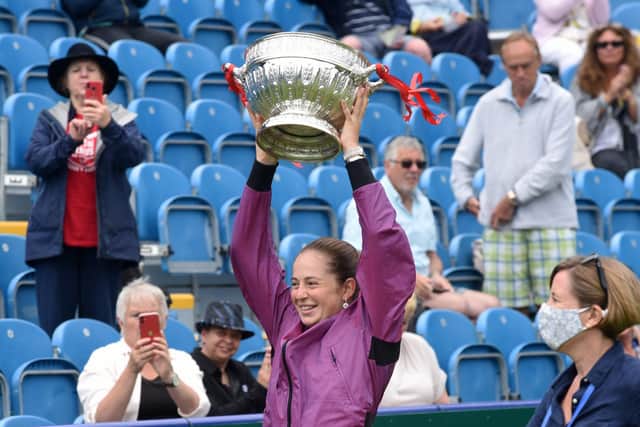 Jeļena Ostapenko lifts the women's singles title last weekend / Picture: Jon Rigby