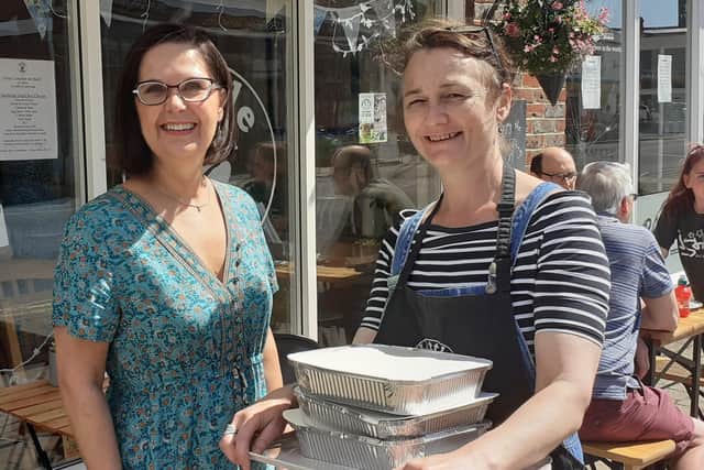 Denise Campbell (left) with Tracey Dowse of Little Bean Cafe, who has generously supplied the food SUS-210607-130122001