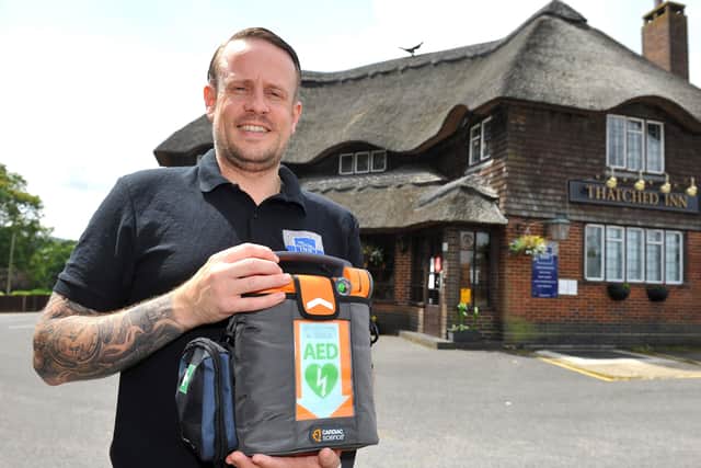 Landlord David Simmons at the Thatched Inn, Hassocks, with the new defibrillator. Picture: Steve Robards, SR2107051.