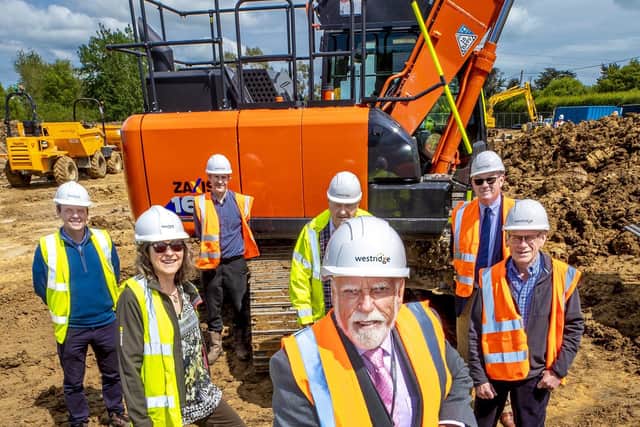 Cllr Terry Byrne celebrates the start of construction for new homes in Icklesham with representatives from Hastoe, IPCLT, Icklesham Parish Council, Rother District Council and Westridge Construction. Picture supplied by Hastoe SUS-210607-112632001