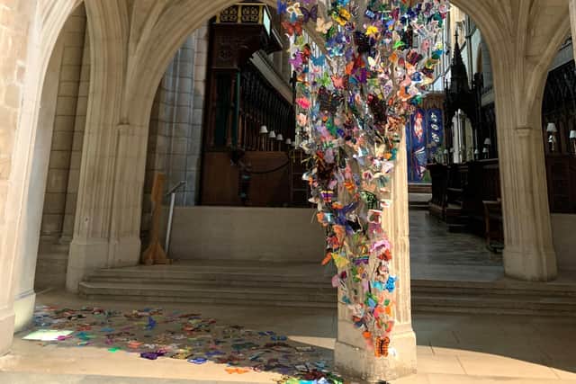 More than 1,400 butterflies have been incorporated in the Called by Name sculpture, which is on display across the Arundel Screen in the Chichester Cathedral Nave