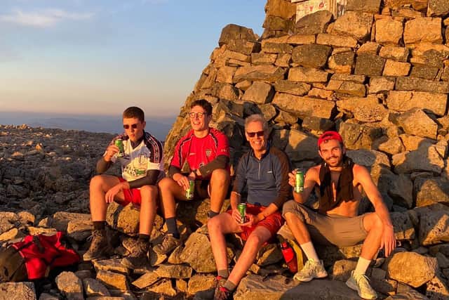 At the top of Ben Nevis, at the end of the final climb, from left, Eddie Tozer, Max Tozer, Roger Tozer and Elliot Arthur-Worsop