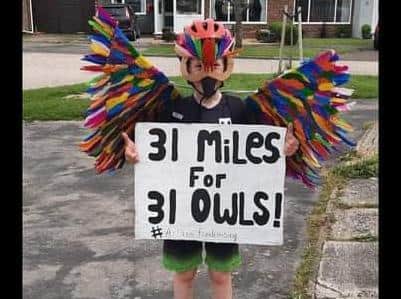 Eight-year-old Arlan West has raised more than 1,200 for Owls About Town