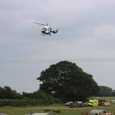 An air ambulance arrives at the scene of the crash on Wednesday. Picture by Eddie Mitchell
