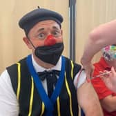 Peppi the clown from Jay Miller's Circus gets his Covid jab at Clair Hall, Haywards Heath.