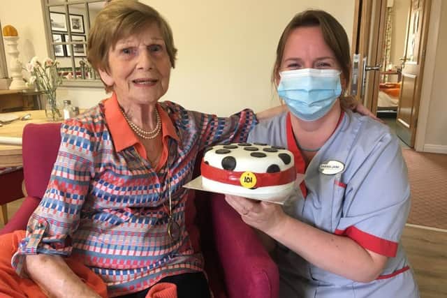 The 101st birthday cake was home-made specially for the occasion by Wellington Grange companionship team member Sarah-Jane Willis, right, and resident Bee Andrews