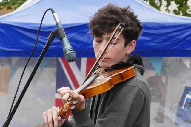 Matthew English playing his violin at Lancing Village Market on Saturday, July 3