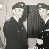 Ken Gould is pictured (left) receiving his Long Service Good Conduct Medal from Archie Winning CBE, former Chief Fire Officer of East Sussex Fire and Rescue Service
