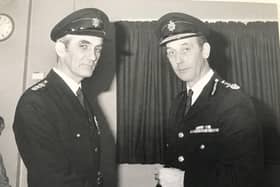 Ken Gould is pictured (left) receiving his Long Service Good Conduct Medal from Archie Winning CBE, former Chief Fire Officer of East Sussex Fire and Rescue Service