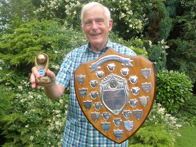 Phil with his shield and trophy, awarded for his work on telling the story of Albion legend Tommy Cook