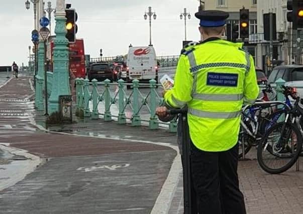 Policce speaking with an e-scooter rider in Brighton