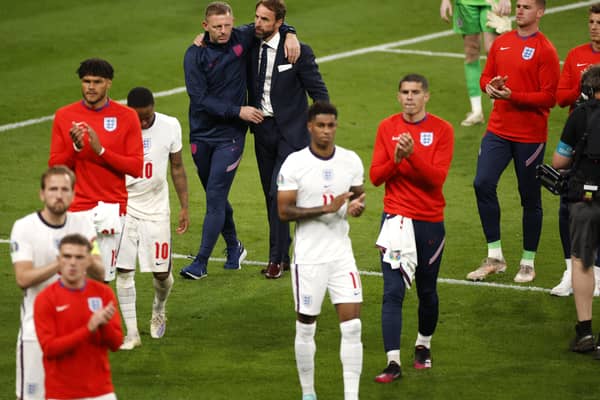 The England football team applauding fans after losing the Euro 2020 final on penalties to Italy Photo: John Sibley - Pool/Getty Images NNL-211207-101824001