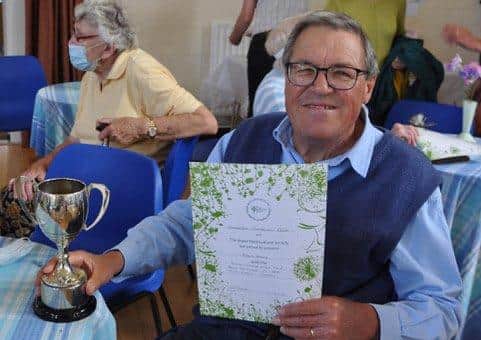Robert Baly won the Silver Challenge Cup for best exhibit in the cut flower classes with his roses