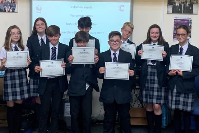Year-seven students with their charity ambassador certificates