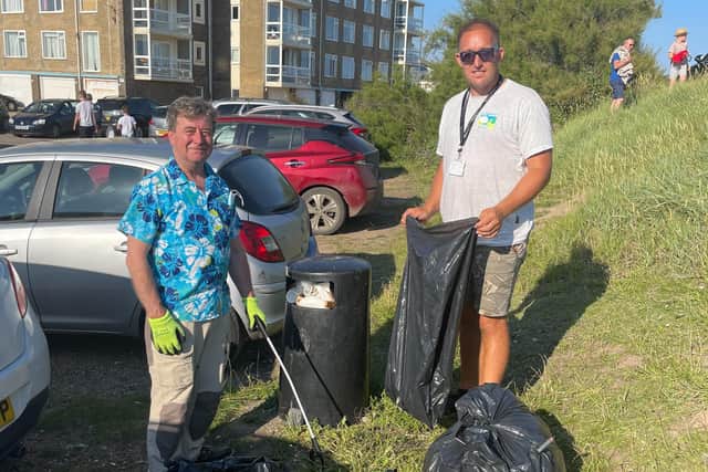 Cllrs Joe Pannell and Andy McGregor cleaning up the rubbish at Widewater Lagoon Car Park in Lancing