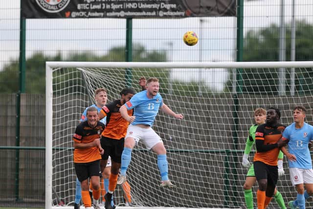 Sam Adams jumps to it at Walton Casuals / Picture: Scott White