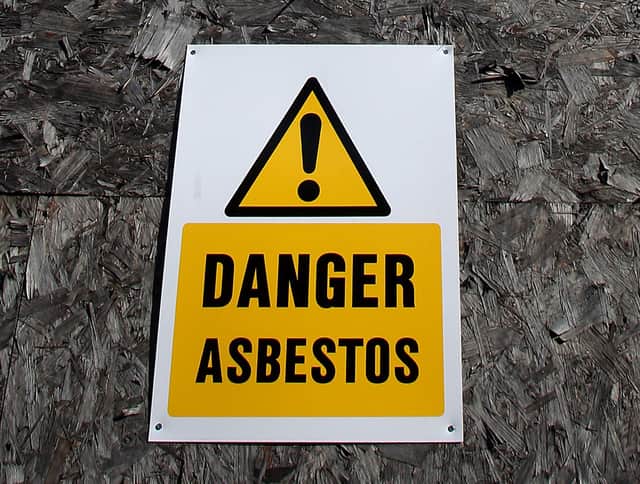 An asbestos warning sign (Credit: Stephen Pond/PA Images)