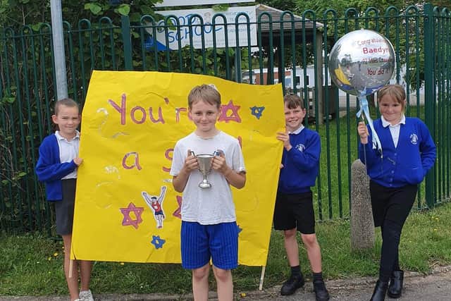 Baedyn ran the last mile at his school on Friday, June 30, 'with every student and member of staff out cheering him on'