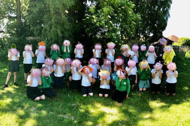 Greenway Academy pupils with their 3D self-portraits which they created as part of an exhibition alongside other Horsham pupils who were once again unable to take part in Horsham's children's parade due to the coronavirus SUS-210720-140212001