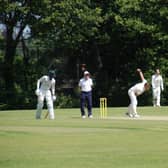 Jimmy Anyon bowls for Cuckfield CC as Haywards Heath CC’s Shelton Forbes watches on. Picture by David Reid