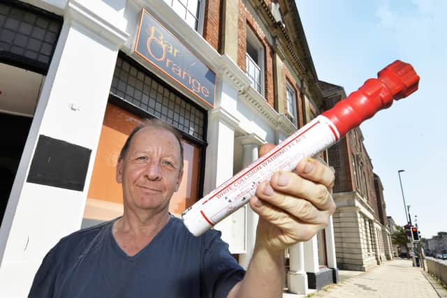 David McLaughlin with the hand flare outside Bar Orange in Worthing. Picture: Jon Rigby