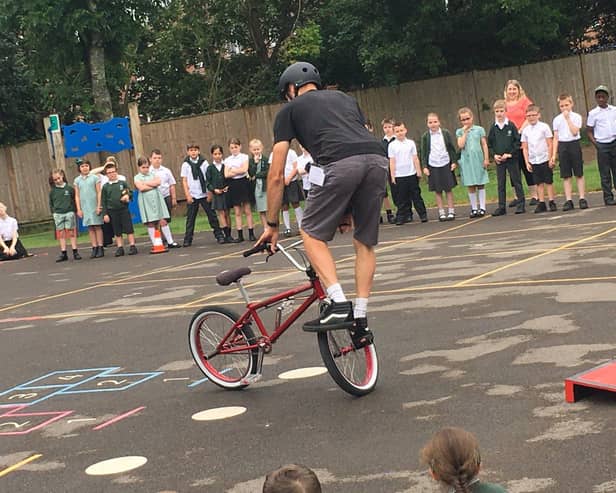 Former world champion BMX rider Mike Mullen showed children tricks on their bikes when he spent the day at The Laurels Primary School in Worthing