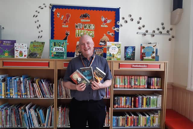 Graeme Page, library assistant, in the children's library