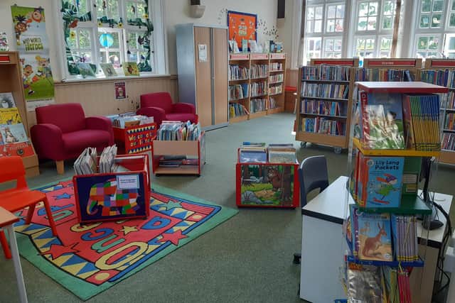 Families are encouraged to search the shelves of colourful books in the children’s library