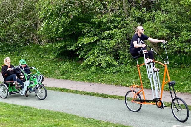 Circus performer Nick Cook with his bespoke 7ft stilt bike