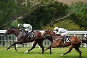 Pat Dobbs riding Beat Le Bon (L) to win the Unibet Golden Mile Handicap at Goodwood in 2019 / Picture: Getty