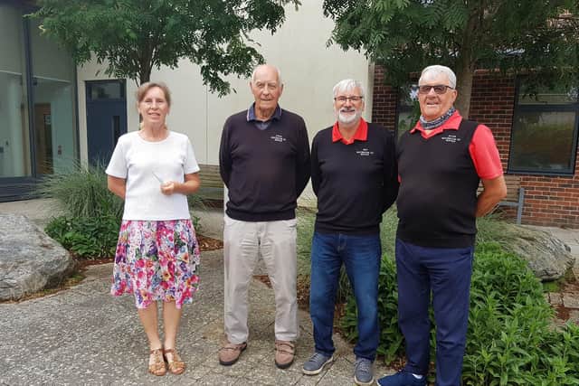 The Rustics' chairman, captain/treasurer and secretary, Roy, Steve and Allan, present a cheque for £3,000 to Mary Bye, community fundraiser, at St Barnabas House hospice in Worthing