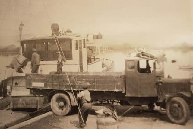 Loading grain on to a ship at Dell Quay, circa 1930s. Image courtesy of Bleach of Lavant Ltd.