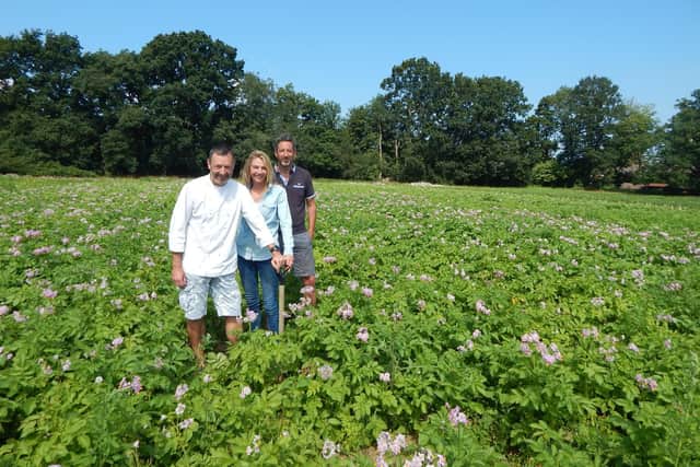 Chef Stephen Toward, Kirsty and Matt Allen in the potato field