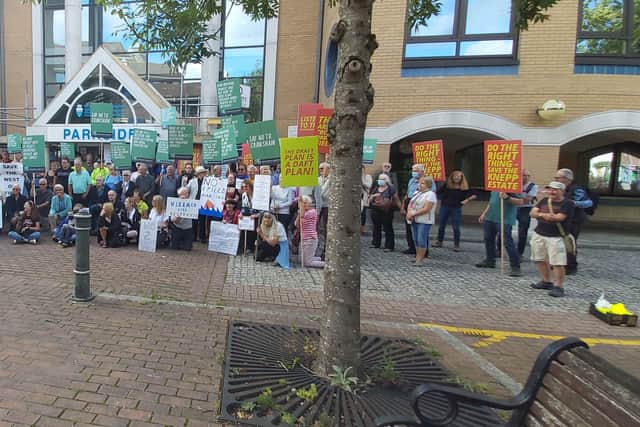 Protesters gather outside Horsham District Council offices - despite a meeting about the Local Plan being cancelled at the last minute