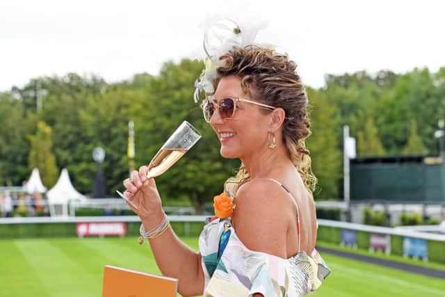 Champagne and a racecard - what more do you need? Picture: Malcolm Wells