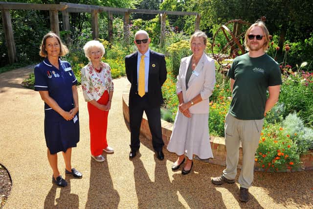 St Barnabas House head of community services Ellie Hayter, patron Margaret Bamford, chief executive Ben Merrett and patron Caroline Nicholls with Highdown Gardens plant heritage expert Alex New at the hospice celebration. Picture: Steve Robards SR2107296