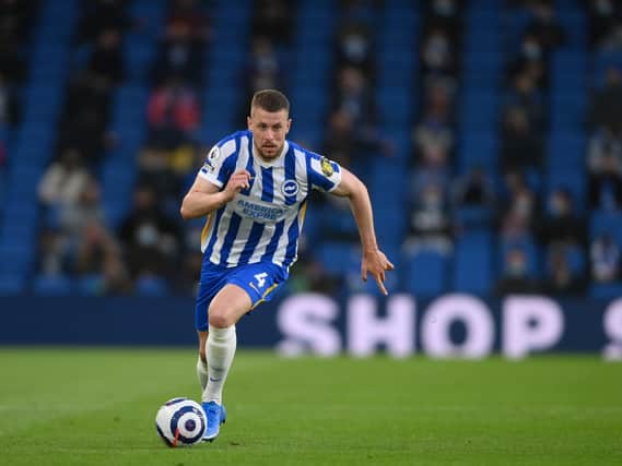 Adam Webster has agreed a new deal at Brighton