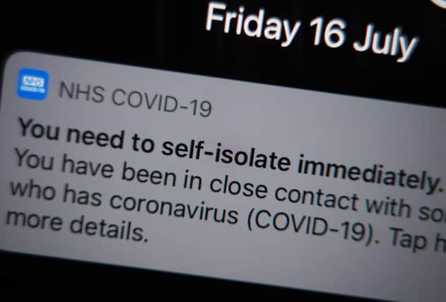 A notification issued by the NHS coronavirus contact tracing app - informing a person of the need to self-isolate immediately, due to having been in close contact with someone who has coronavirus - is displayed on a mobile phone in London, during the easing of lockdown restrictions in England. Picture date: Friday July 16, 2021. EMN-210208-155544001