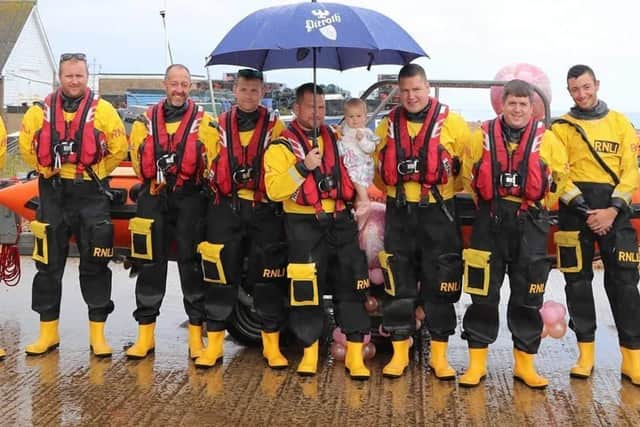 The Eastbourne RNLI crew at the christening. Picture from Eastbourne RNLI. SUS-210308-102400001