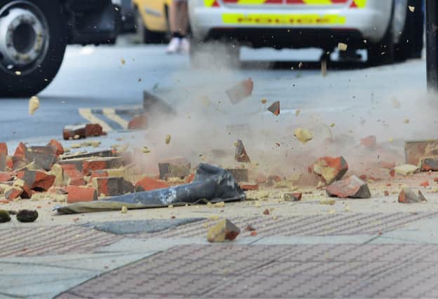 Loose bricks falling from the old Queensbury House building in Hastings. Pic Justin Lycett SUS-210308-150829001