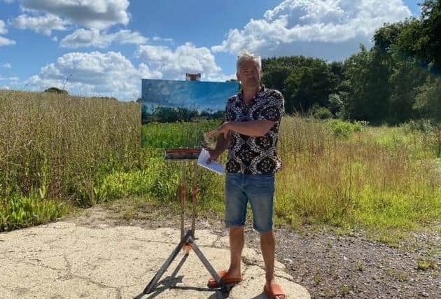 Grant Dejonge with his artwork