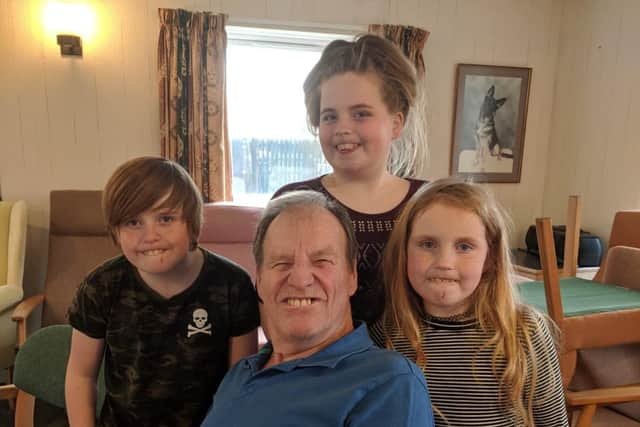 Jim Goddard with some of his grandchildren. SUS-210408-150621001